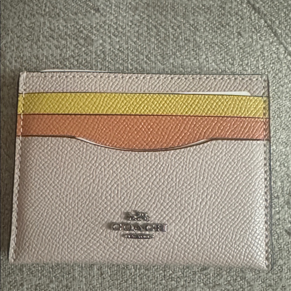 NWT, Coach vintage pink-multi color card case .
